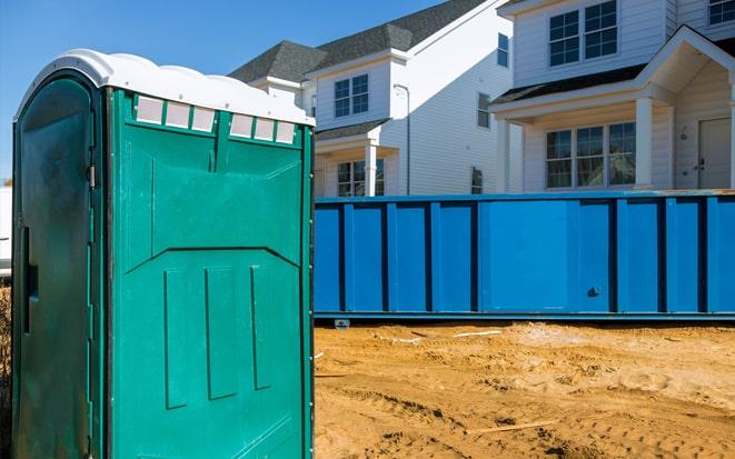 portable toilet and dumpster at a construction site project in Roanoke VA
